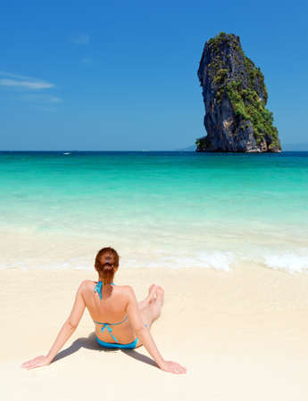 Young woman on the tropical beach.の写真素材