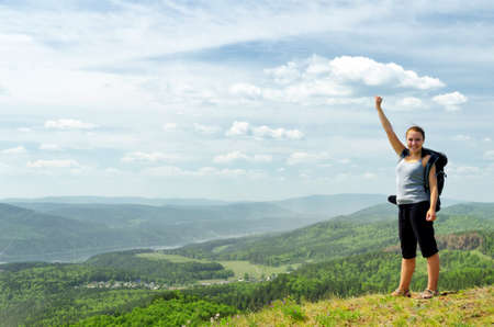 Young hiker on the hilltop.の写真素材