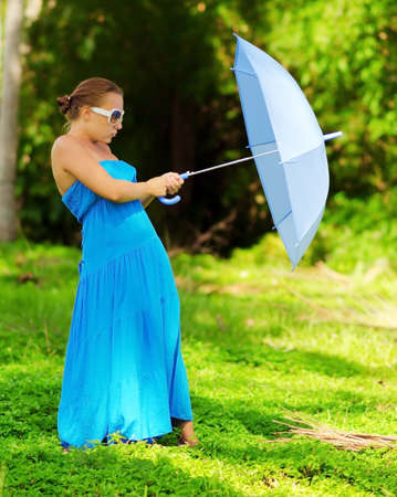 Young woman with umbrella  Outdoor portrait の写真素材