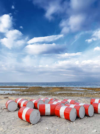 Lot of oil barrels on a seashore  Environment pollution の写真素材