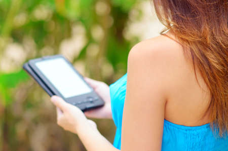 Woman with e-book in hands.