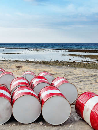 Lot of oil barrels on a seashore. Environment pollution.の写真素材