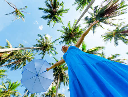 Young woman with umbrella  Outdoor portrait の写真素材