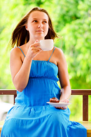 Woman enjoys cup of coffee の写真素材