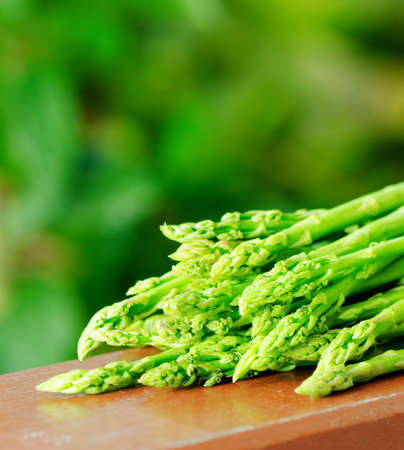 Fresh green asparagus in a garden の写真素材