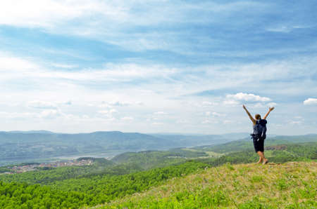 Young hiker on the hilltop.の写真素材