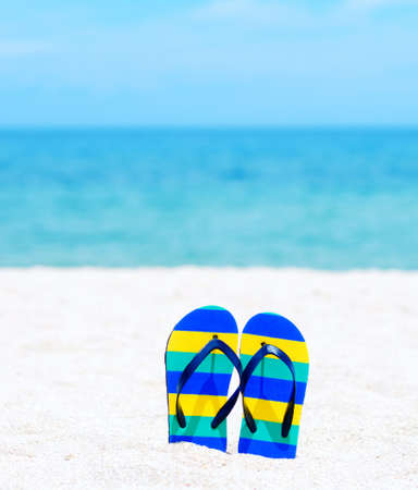 Flip flops on a tropical beach.の写真素材