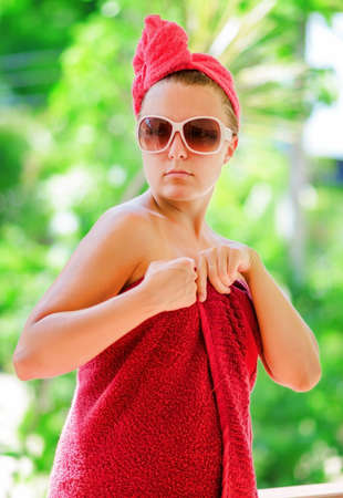 Glamorous woman in red towel.の写真素材