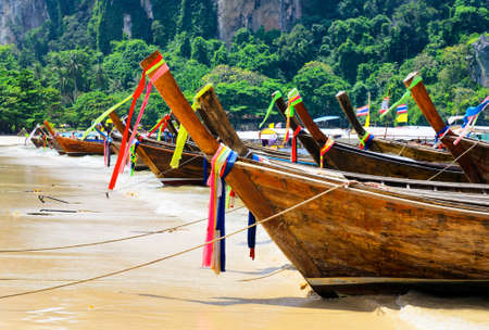 Traditional thai boats at the beach of Krabi province の写真素材