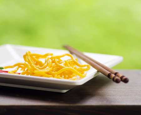 Egg noodles on nature background.の写真素材