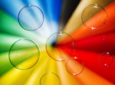 Soap bubbles and multi-coloured background の写真素材