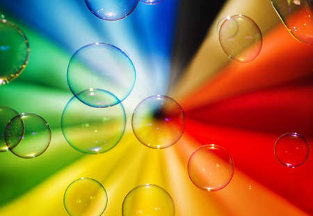 Soap bubbles and multi-coloured background.の写真素材