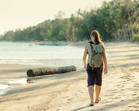 Young woman hiking with backpack.の写真素材