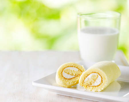 Glass of milk and fresh cake.の写真素材