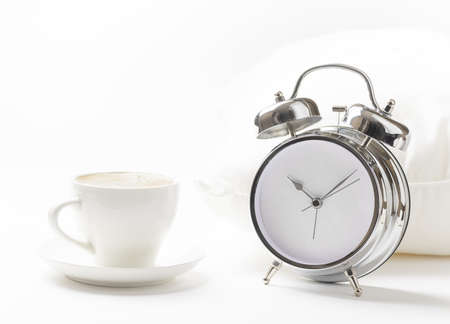 Cup of coffe and alarm clock. の写真素材