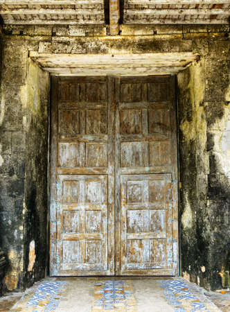 Locked old wooden church door.の写真素材