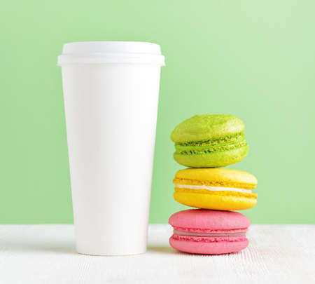 Macaron and tumbler of coffee.の写真素材