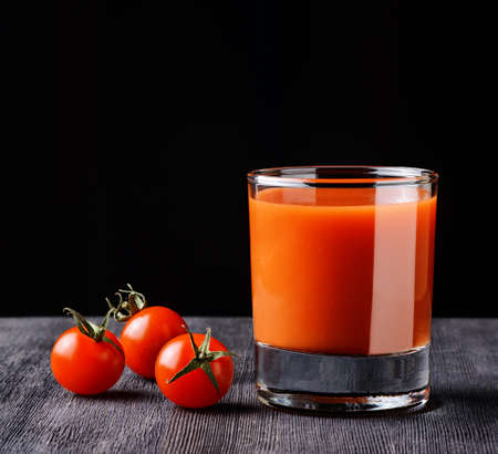Glass of tomato juice on a table.の写真素材