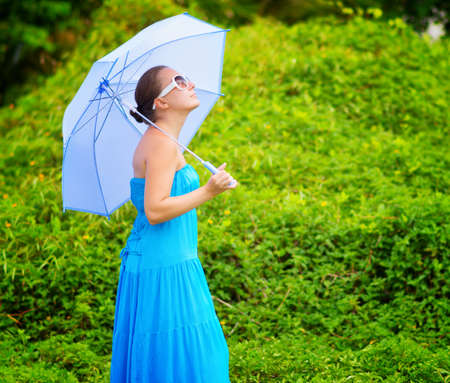 Portrait of young beautiful woman outdoors.の写真素材