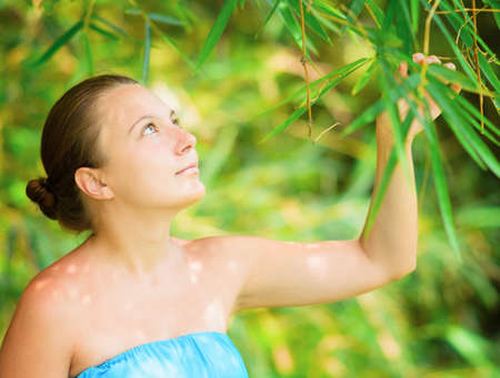 Portrait of young beautiful woman outdoors.の写真素材