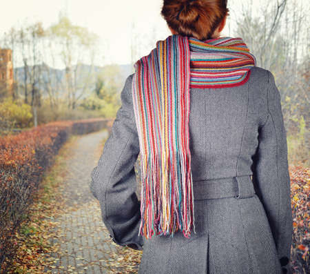 Young woman walking in the fall season  Autumn outdoor portrait の写真素材