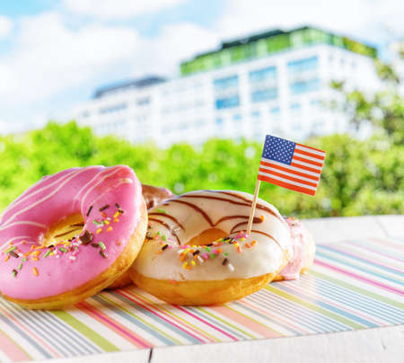 Colorful donuts with flag of USA. American fast food.の写真素材