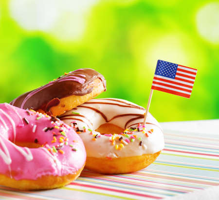 Colorful donuts with flag of USA. American fast food.の写真素材