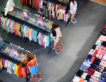 Big sale of fashionable women's clothing and lingerie in store.