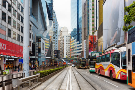 HONG KONG - JANUARY 28, 2015: Decker buses and skyscrapers on the central streets. Hong Kong is a...