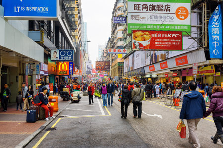 HONG KONG - FEBRUARY 1, 2015: Pedestrians on streets of city Hong Kong. Hong Kong is a popular tourist attraction of Asia and leading financial centre of the world.のeditorial素材