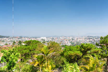 Beautiful view of the valley and Da Lat city (Dalat) on the blue sky background in Vietnam. Da Lat is a popular tourist destination of Asia.の写真素材