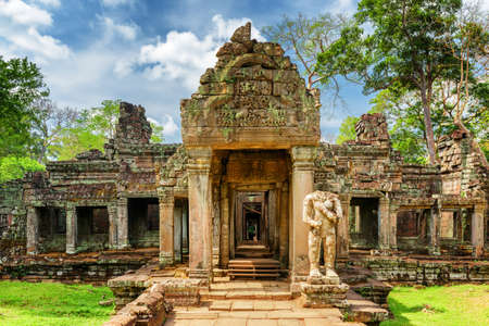 Mossy entrance to ancient Preah Khan temple in Angkor, Siem Reap, Cambodia. Mysterious Preah Khan temple has been swallowed by jungle. Enigmatic Preah Khan is a popular tourist attraction.の写真素材