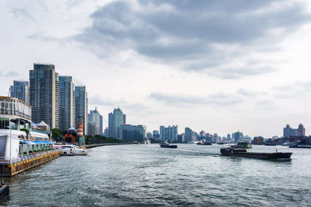 Self-propelled barges on the Huangpu River in Shanghai, China. Shanghai is a global financial center and a transport hub with busiest container port.の写真素材
