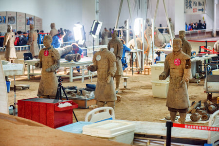 XI'AN, SHAANXI PROVINCE, CHINA - OCTOBER 28, 2015: Chinese archaeologists working at excavation site of the famous Terracotta Army in the Qin Shi Huang Mausoleum of the First Emperor of China.のeditorial素材