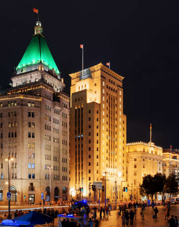 Night view of the Bund (Waitan) in Shanghai, China. The Sassoon House is visible at left. Shanghai is a global financial center and a popular tourist destination of Asia.の写真素材