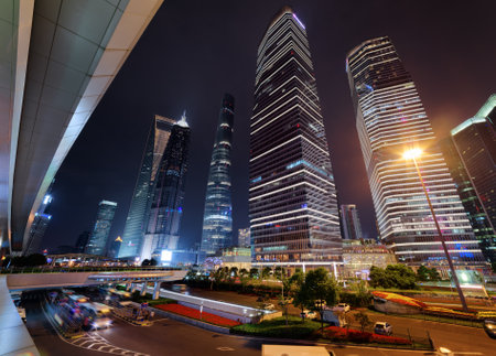 Amazing view of skyscrapers on Century Avenue at night. The Shanghai World Financial Center (SWFC),...