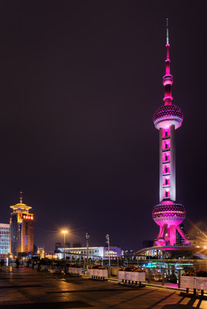 Night view of the Oriental Pearl Tower from pedestrian side of Century Avenue in downtown, the Pudong New District (Lujiazui) of Shanghai, China. The famous tower glows pink.のeditorial素材