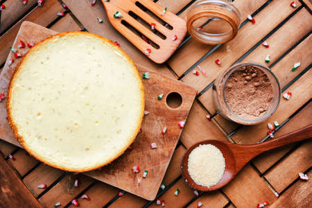 Top view of delicious freshly baked cheesecake on wooden board. Homemade sweet dessert, family meal....