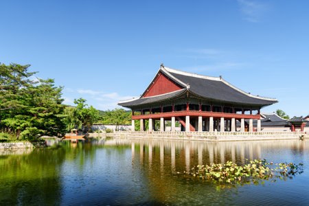 Wonderful view of Gyeonghoeru Pavilion and Gyeongbokgung Palace, Seoul, South Korea. Amazing buildings of traditional Korean architecture. The Royal Banquet Hall reflected in water of artificial lake.のeditorial素材