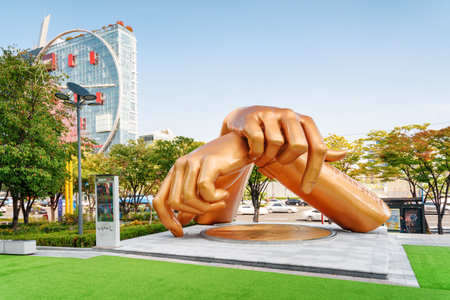Seoul, South Korea - October 14, 2017: Statue of Gangnam Style is a new landmark of Gangnam District. The sculpture dedicated to the famous song among green trees on blue sky background on sunny day.のeditorial素材