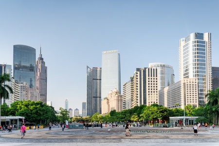 Guangzhou, China - September 16, 2017: Scenic view of a beautiful city park among modern buildings in the Tianhe District of the Zhujiang New Town. Guangzhou is a popular tourist destination of Asia.のeditorial素材