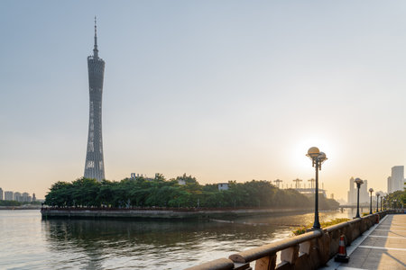 Guangzhou, China - September 16, 2017: Beautiful view of the Pearl River and setting sun at downtown of Guangzhou. Amazing summer cityscape at sunset. The Canton Tower on blue sky background.のeditorial素材