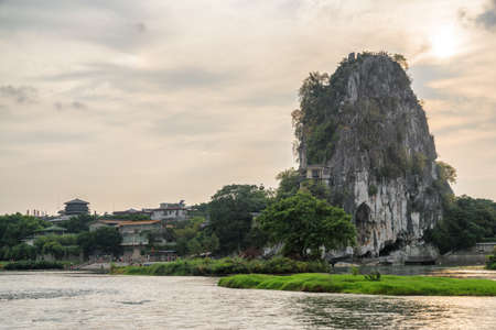 Wonderful view of the Fubo Hill (Wave Subduing Hill) and the Li River (Lijiang River) in Guilin at sunset. Evening landscape in China. Guilin is a popular tourist destination of Asia.の写真素材