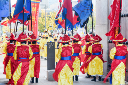 Seoul, South Korea - October 15, 2017: Performers wearing Korean traditional dress and holding flags in Gwanghwamun Gate of Gyeongbokgung Palace.のeditorial素材