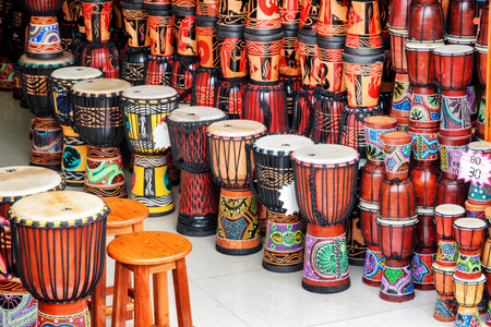 Fenghuang, China - September 22, 2017: Wide range of colorful djembe drums at souvenir shop in Phoenix Ancient Town (Fenghuang). Fenghuang is a popular tourist destination of Asia.のeditorial素材