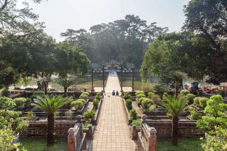 Top view of bridge crossing the Lake of the New Moon (Tan Nguyet) and beautiful garden at the Minh Mang Tomb in Hue, Vietnam. Hue is a popular tourist destination of Asia.の素材 [FY310102203413]