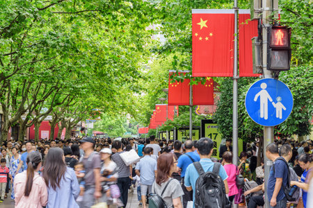 Shanghai, China - October 3, 2017: Crowd on Nanjing Road at downtown of Shanghai. Tourists and residents walking along the pedestrian street on the National Day holidays. Golden Week in China.のeditorial素材