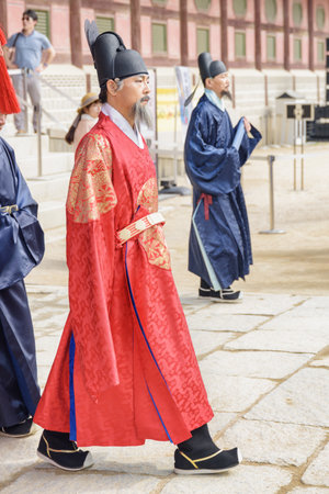 Seoul, South Korea - October 9, 2017: Emperor walking along courtyard of Gyeongbokgung Palace.のeditorial素材