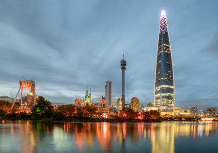 Beautiful evening view of skyscraper by lake at downtown of Seoul in South Korea. Amazing modern tower on blue sky background.のeditorial素材