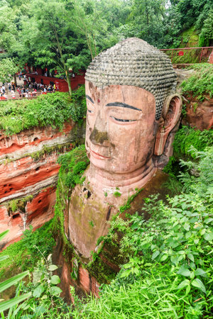 Leshan, China - September 28, 2017: Beautiful view of the Leshan Giant Buddha. The largest and tallest stone Buddha statue in the world carved out of a red cliff at the Mount Emei Scenic Area.のeditorial素材